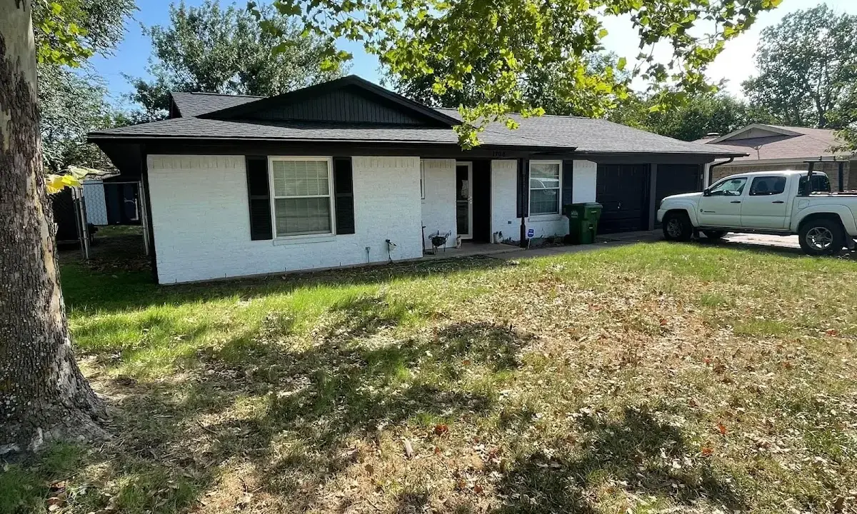 Professional roofing crew working on a residential roof in Panthersville